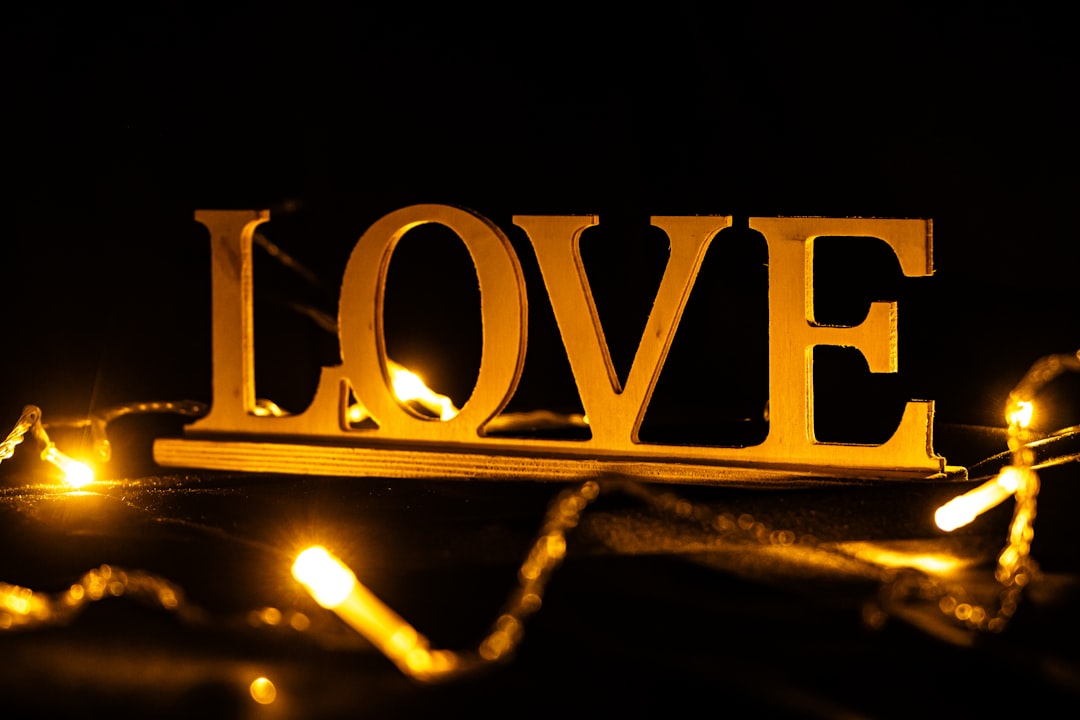 Golden love sign with bokeh lights