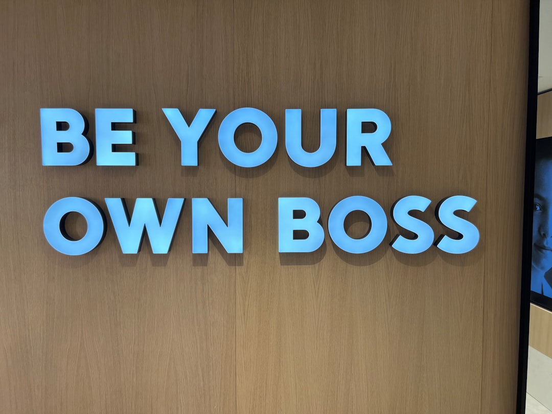a sign that says be your own boss