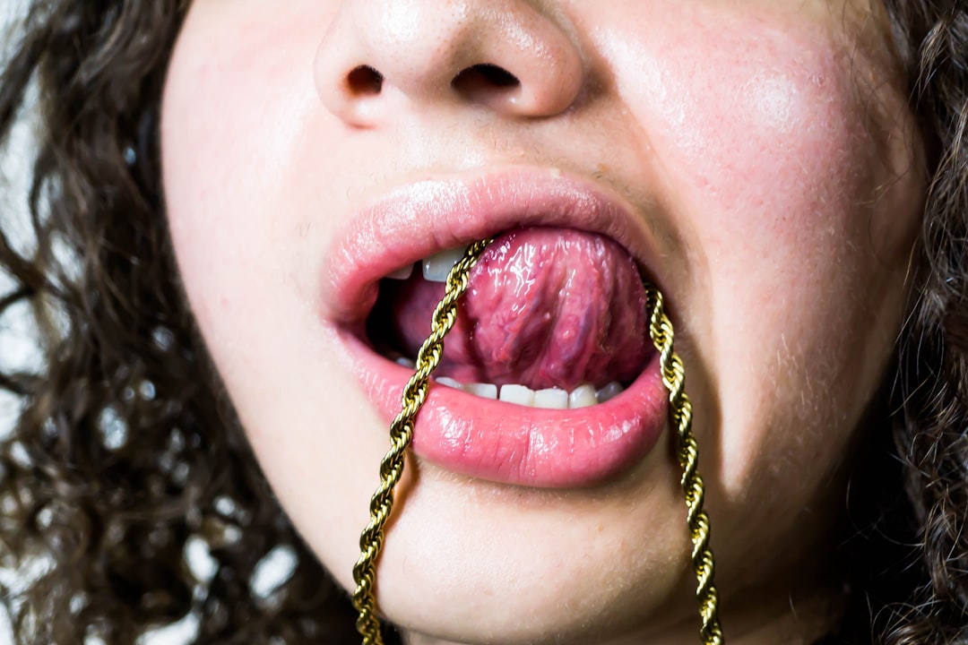 A woman with a chain around her mouth