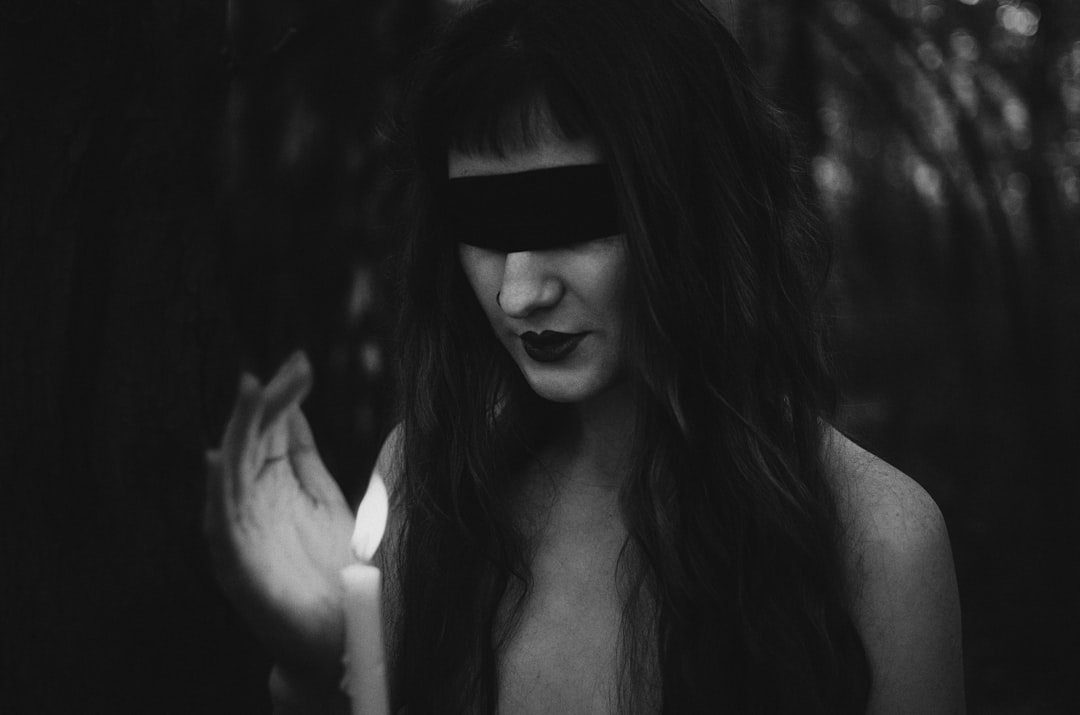 A black and white photo of a woman with long hair