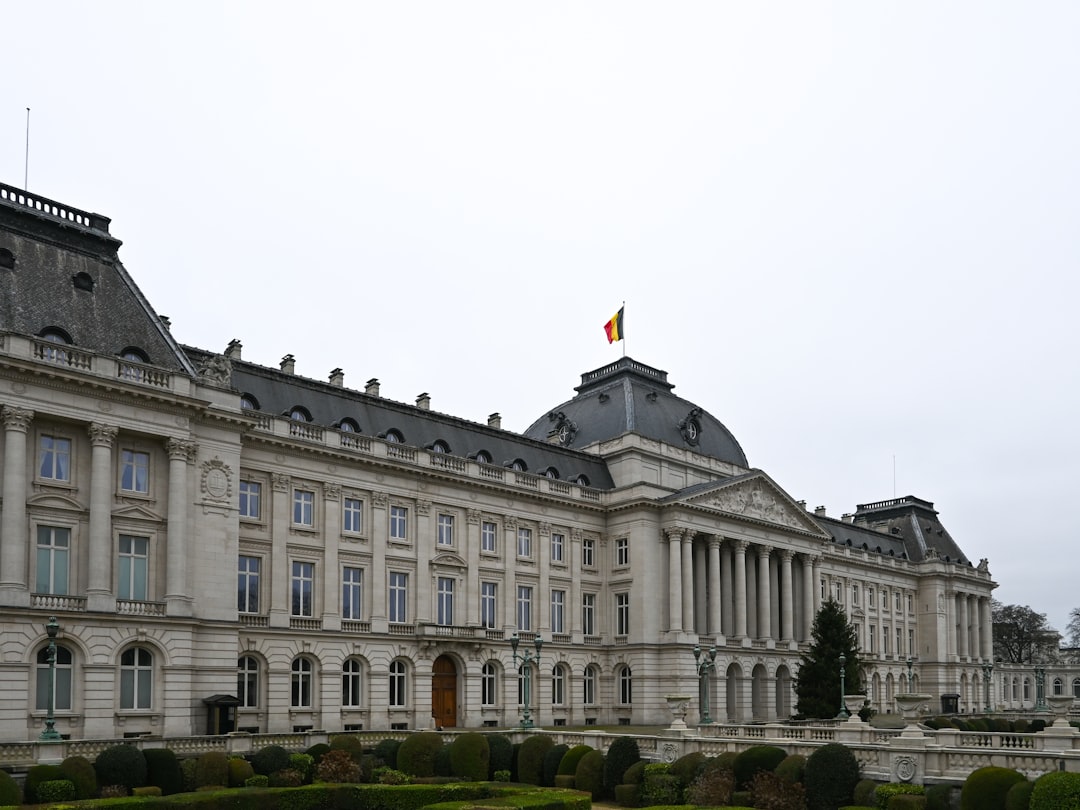 Grand neoclassical palace with a flag on top